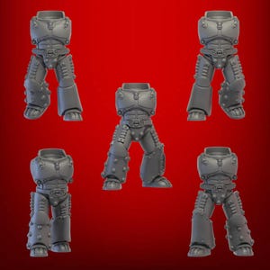 May include: Five grey miniature armoured legs, possibly for a tabletop game or model. Each piece features detailed plating, rivets, and a belt. The legs are posed in various positions against a red background.