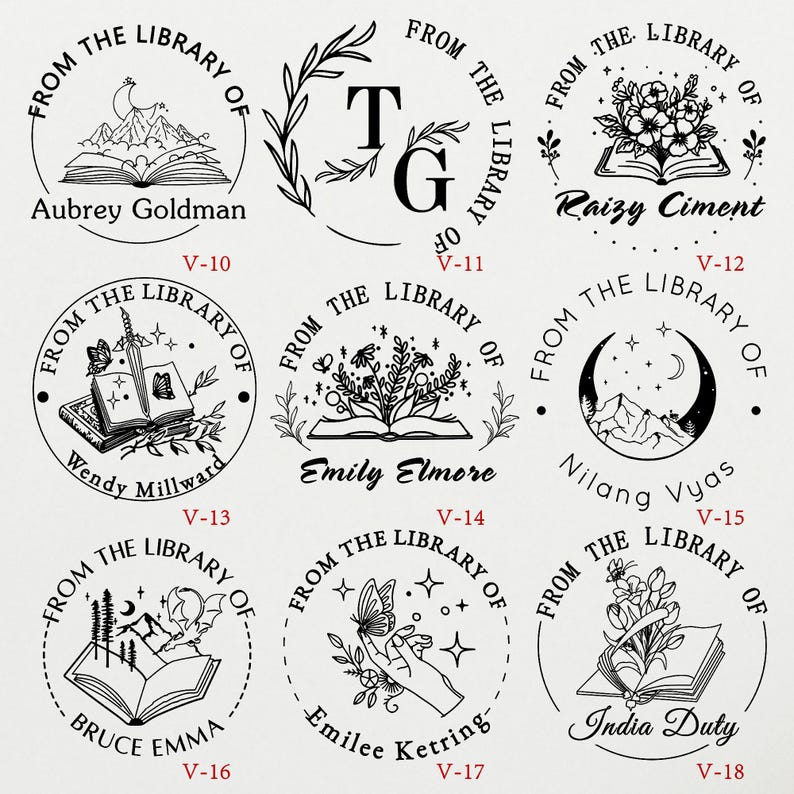 May include: Set of 10 round black and white rubber stamps with different designs. Each stamp features a book, a mountain, a flower, a butterfly, a crescent moon, a sword, and a hand. The stamps are labeled with the names Aubrey Goldman, Wendy Millward, Bruce Emma, Raizy Ciment, Nilang Vyas, India Duty, Emily Elmore, Emilee Ketring, and T.G. Each stamp also has a number from V-10 to V-18.