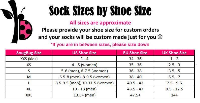May include: A chart titled "Sock Sizes by Shoe Size" with a pink and white design. The chart provides sock sizes based on US, EU, and UK shoe sizes. The chart includes sizes for kids and adults. The text states that all sizes are approximate.