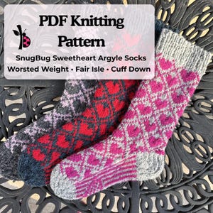 May include: Three knitted socks with argyle patterns. One sock is primarily pink with grey accents, another is red with black accents, and the third is grey with purple accents. The socks are labelled "PDF Knitting Pattern".