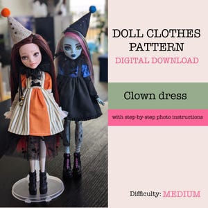 May include: Two dolls in clown costumes. One doll has a striped dress with orange panels and a party hat. The other doll wears a black dress with blue details and a matching hat. Text reads "DOLL CLOTHES PATTERN" and "Clown dress".