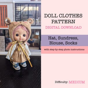 May include: A doll wearing a brown bear-eared hat, sundress, blouse, and socks. The doll has pink hair and is wearing blue sneakers. The image includes text that reads "DOLL CLOTHES PATTERN DIGITAL DOWNLOAD" and lists the items included in the pattern. The difficulty level is medium.