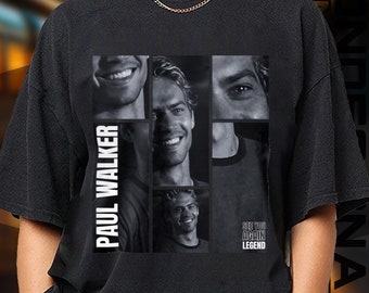 May include: Black t-shirt featuring a collage of Paul Walker's images. The shirt includes the text "PAUL WALKER" vertically and "FOREVER LEGEND" at the bottom. The brand logo "APHELION DESIGN" is at the bottom.