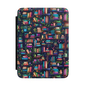May include: A dark blue e-reader cover featuring a colorful illustration of a bookshelf filled with books, plants, and small vases. The books are in various colors, including red, blue, green, and purple. The cover has a black spine.