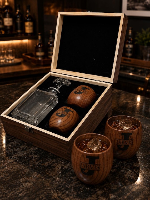 Custom-engraved whiskey decanter set in a gift box with wooden cups — a genuinely impressive, shelf-worthy bar piece with strong gifting energy.