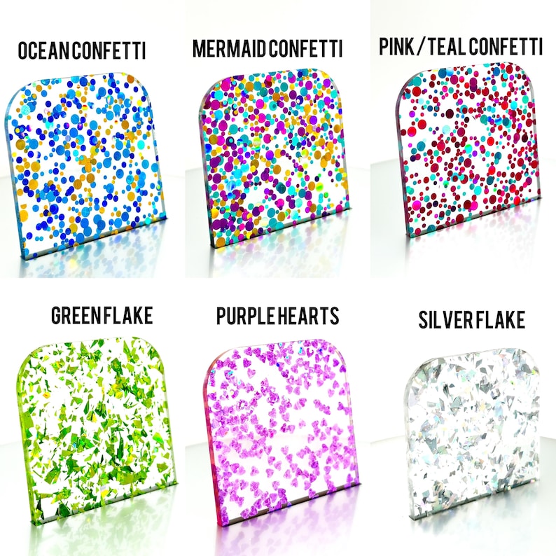 May include: Six samples of confetti in various colors and shapes. The samples are labeled "Ocean Confetti", "Mermaid Confetti", "Pink/Teal Confetti", "Greenflake", "Purple Hearts", and "Silverflake". Each sample is in a clear, rectangular container.
