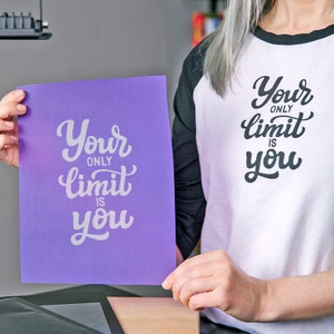 May include: A purple stencil with the text "Your only limit is you" in white lettering.