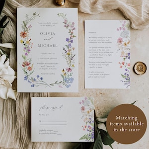May include: Wedding invitation suite with floral designs. The invitation features a wreath of colorful flowers with the names Olivia and Michael. The details card includes information about the ceremony and reception. The RSVP card has a floral border and a place to indicate acceptance or decline.