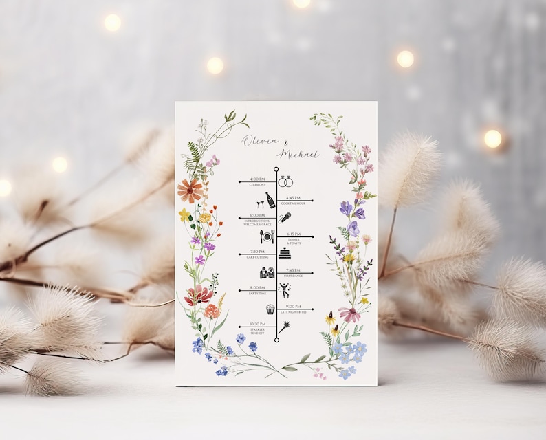 May include: A wedding timeline card featuring the names "Olivia & Michael" at the top. The card has a floral border with colorful flowers. The timeline includes ceremony, dinner, and party details, with corresponding icons.