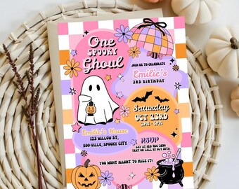 May include: A colorful Halloween-themed invitation with the text "One Spooky Ghoul." The design includes a cartoon ghost holding a lantern, a jack-o'-lantern, and a cauldron. The invitation is for Emilie's 3rd birthday on October 23rd.