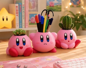 May include: Three pink, round, character-shaped containers with blue and black eyes. The left one holds a green succulent, the center one holds various colored pens and pencils, and the right one holds a green cactus. Each has small red feet.