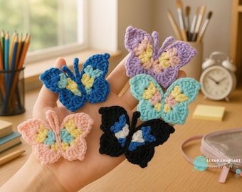 May include: A collection of handmade crochet butterfly appliques in various colors, including blue, pink, purple, and black. Each butterfly features a detailed wing pattern with yellow and pastel accents, perfect for crafting projects.