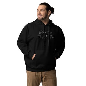 May include: Black hooded sweatshirt with the text "Aqui Nos Traz E Rio!" in white lettering.