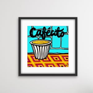 May include: A framed art print featuring a cup of coffee with the word "Cafecito" above it. The coffee cup is white with black vertical stripes. The background is a blue wall with a yellow and orange patterned floor.