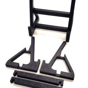 Display your wrestling championship belts in style with this sturdy wrestling belt display stand. This stand provides a secure and elegant way to showcase your title belts on desks, shelves, or display cases. Ideal for collectors, fans, and wrestlers who want to present their belts without wall installation. The sleek design ensures stability while highlighting your belt's details, making it the perfect centerpiece for your wrestling memorabilia collection.