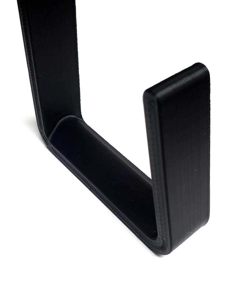 Show off your championship pride with this premium wrestling belt wall mount hanger. This L-shaped hook system is designed to securely hold and display your wrestling championship belts on any wall. Perfect for collectors, wrestling fans, or athletes, it keeps your title belts safe, organized, and proudly showcased. Easy to install with screws, this belt hanger is both functional and stylish, adding a professional look to your display space.