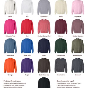 May include: A color guide for adult crewneck sweatshirts by ElegantCozyTees, displaying 21 different color options including white, ash, sport grey, sand, light pink, heliconia pink, red, heather scarlet red, maroon, heather maroon, indigo blue, royal blue, navy, forest green, military green, orange, purple, dark chocolate, dark heather, charcoal, and black.