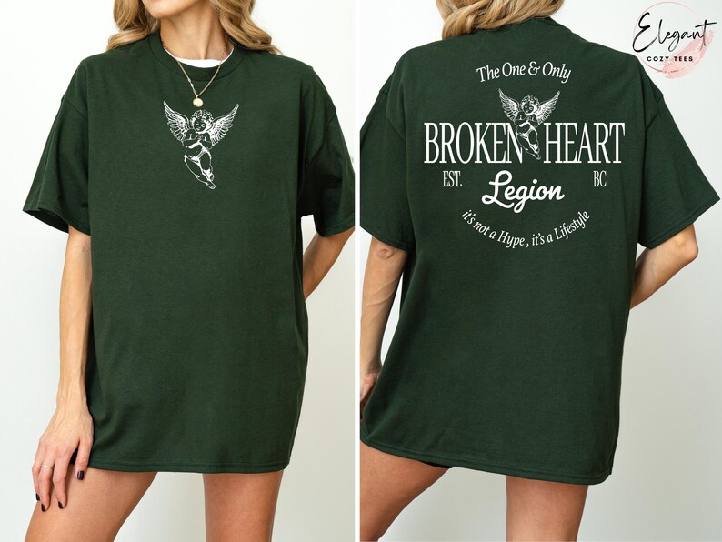 Dark green t-shirt with angel graphic and "Broken Heart Legion" text on back.