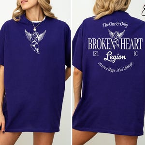 Dark blue t-shirt with angel and text "Broken Heart Legion" on back.