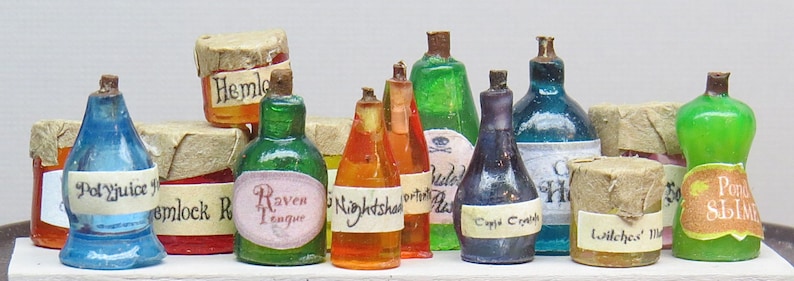 May include: A collection of ten glass bottles with cork stoppers and labels. The bottles contain various colored liquids and have labels with names like "Hemlock", "Raven Tongue", "Nightshade", "Witches' Brew", and "Poison Slime".