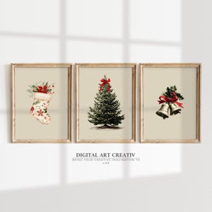 May include: Three framed prints with a Christmas theme. The prints feature a stocking, a Christmas tree, and bells, all adorned with red bows and festive details. The background is a neutral beige color.