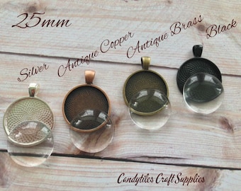 May include: Five 25mm round glass cabochons with metal settings in silver, antique copper, antique brass, and black. The glass cabochons are clear and the metal settings have a decorative design.