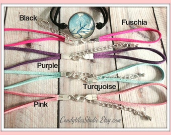 May include: Five suede cords in different colors, fuchsia, purple, turquoise, pink, and black, with silver clasps and chain connectors.  The cords are displayed on a wooden surface.  Candytiles Studio.Etsy.com