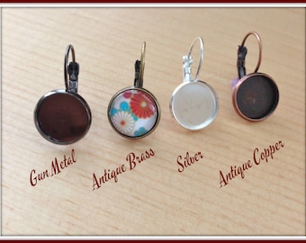 May include: Four lever-back earrings in gun metal, antique brass, silver, and antique copper finishes. The antique brass earring features a floral design. The text on the image reads "Gun Metal", "Antique Brass", "Silver", and "Antique Copper".