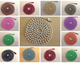May include: Assortment of 12 colors of ball chain, each chain is coiled in a circle. The colors are: copper, red, pink, silver, purple, orange, green, black, teal, burgundy, and lime green.