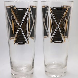 2 vasos altos Federal Glass con diseño geométrico en negro y dorado.