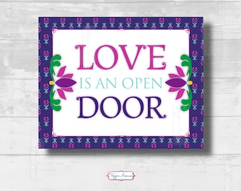 May include: A purple and blue sign with a white background and a floral border. The sign says "Love is an open door".