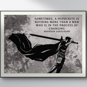 May include: Framed black and white art print. The image shows a silhouette of a figure with a sword and cape, with the quote: "Sometimes, a hypocrite is nothing more than a man who is in the process of changing" by Brandon Sanderson.