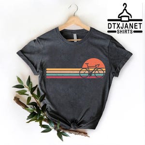 a black shirt with a bicycle on it