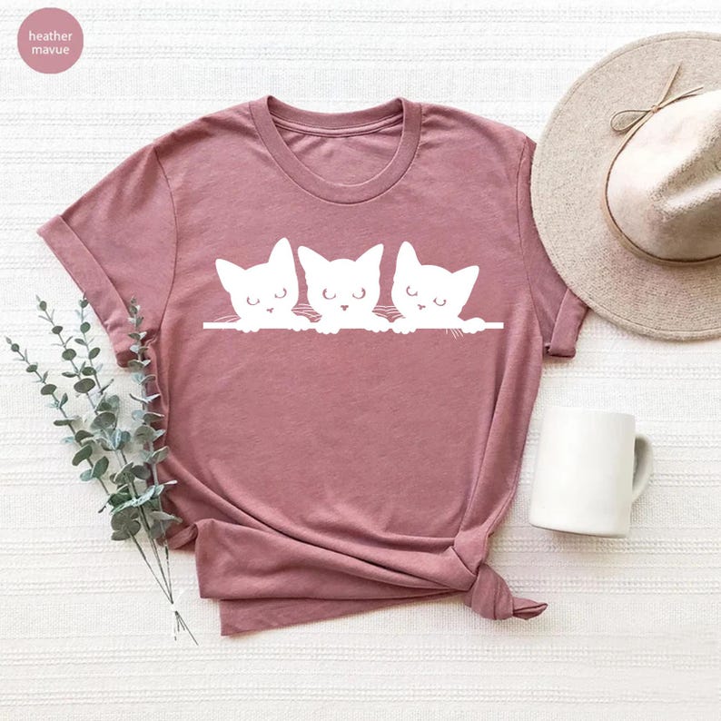 a t - shirt with three cats on it
