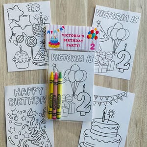 Puede incluir: Un juego de colorear para fiesta de cumplea&ntilde;os con p&aacute;ginas para colorear con ilustraciones tem&aacute;ticas de cumplea&ntilde;os y el texto "Victoria is 2". Incluye un paquete de crayones y una etiqueta que dice "Victoria's Birthday Party!"