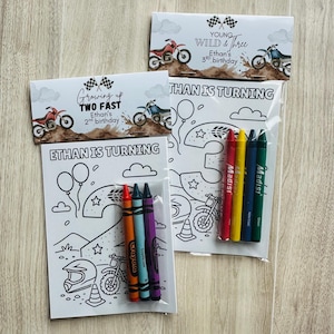 May include: Two birthday colouring pages with crayons. One says "Ethan is turning" and "Growing up TWO FAST, Ethan's 2nd birthday." The other says "Ethan is turning" and "Young Wild & Three, Ethan's 3rd birthday."