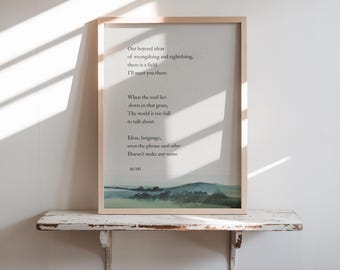 May include: A framed print featuring a poem by Rumi, with a landscape image at the bottom. The text is in black against a cream background. The frame is light-colored wood. The print is displayed on a distressed white shelf.