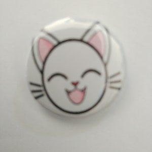 White cat badge