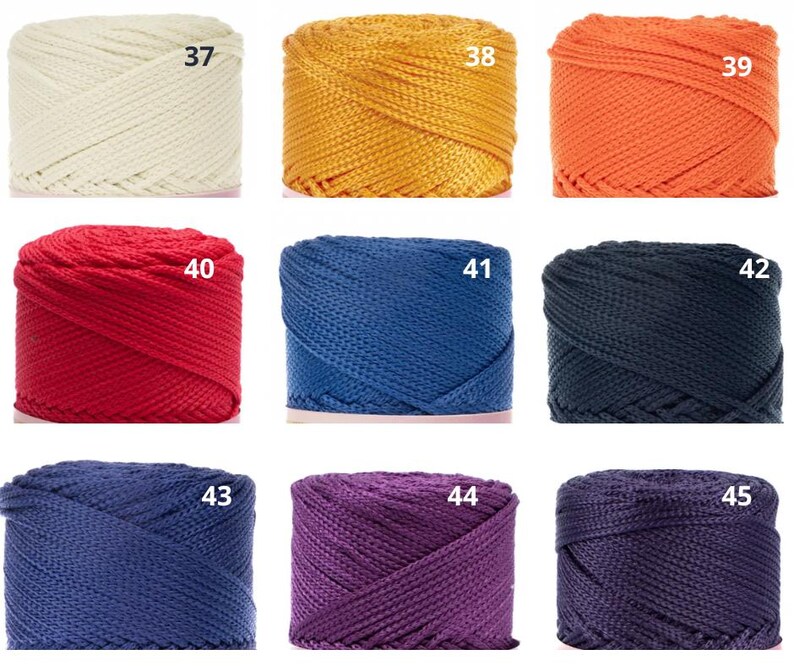 May include: Nine spools of coloured cord in shades of cream, gold, orange, red, blue, navy, dark blue, purple, and dark purple. Each spool is labelled with a number from 37 to 45.