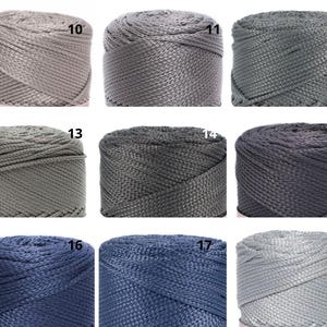 May include: Nine spools of nylon rope in a range of grey and blue hues. Each spool is numbered from 10 to 18. The colours vary from light grey to dark navy, highlighting the rope's texture and colour variations. Ideal for crafting and DIY projects.