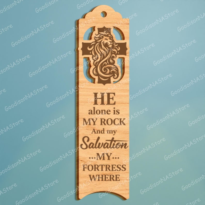 May include: Wooden bookmark with a lion and cross design. The bookmark has the text "HE alone is MY ROCK And my Salvation ...MY... FORTRESS WHERE". The bookmark has a hole at the top for a tassel.