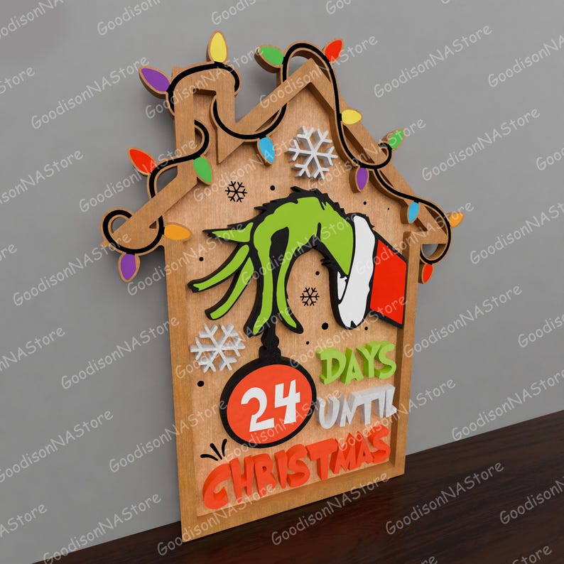 May include: Wooden Christmas countdown sign featuring a Grinch hand, snowflakes, and colorful lights. The sign reads "24 Days Until Christmas" in orange and white lettering. The house-shaped sign is made of wood.