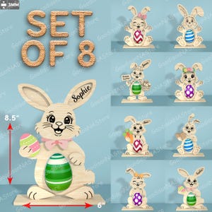 May include: Set of 8 wooden Easter bunny decorations. The large bunny is 8.5 inches tall and has a pink bow tie and holds a green and white egg. The other bunnies have different egg designs and accessories.