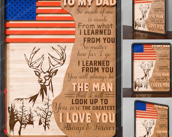 May include: Wooden wall art with a patriotic theme. Features an American flag design, a deer silhouette, and the text "To My Dad, I Love You." The framed piece measures 11 inches by 7 inches.