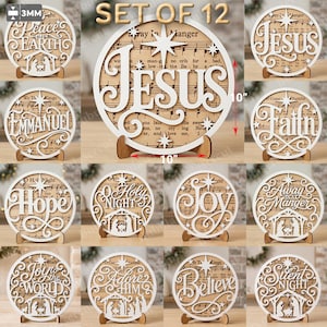 May include: A set of 12 circular wooden signs featuring white laser-cut lettering and nativity scenes layered over sheet music backgrounds. Each sign measures 10 inches in diameter and 3mm in thickness, supported by small wooden stands.