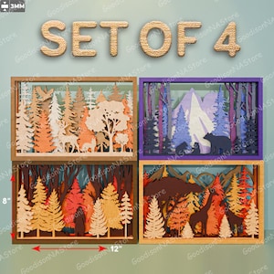 May include: Set of four 3D layered forest art pieces. Each piece is a rectangular frame with a forest scene, featuring trees, mountains, and animals. The frames are 12 inches wide and 8 inches tall, with a variety of colors.
