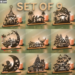 Può includere: Set di nove decorazioni natalizie tagliate al laser. Ogni pezzo nero è montato su una base di legno. I disegni includono un albero di Natale, un presepe, Babbo Natale e un camion che trasporta un albero. È presente anche il testo "Merry Christmas".