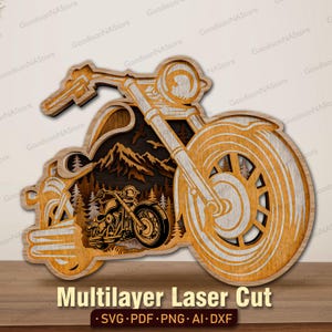 May include: A multi-layered wooden wall art piece shaped like a motorcycle silhouette. The design features a detailed mountain and forest landscape cutout within the frame, with a smaller motorcycle graphic layered in the foreground.