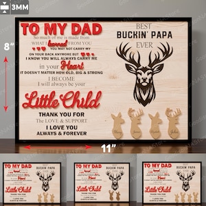 Könnte beinhalten: Ein gerahmtes Holzschild, 28 cm breit und 20 cm hoch, mit dem Text "To My Dad" und "Best Buckin' Papa Ever". Das Schild enthält eine Hirschgrafik und die Namen Mary, James, Elizabeth und John. Der Text ist in Rot und Schwarz.