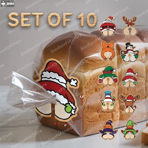May include: Set of 10 Christmas-themed stickers. Each sticker features a cartoon bottom with festive designs, including Santa, reindeer, and elves. The stickers are approximately 2 inches wide and 2.3 inches tall.